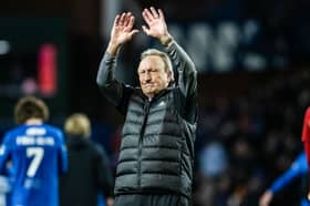 Aberdeen manager Neil Warnock waves to the travelling fans at full time 