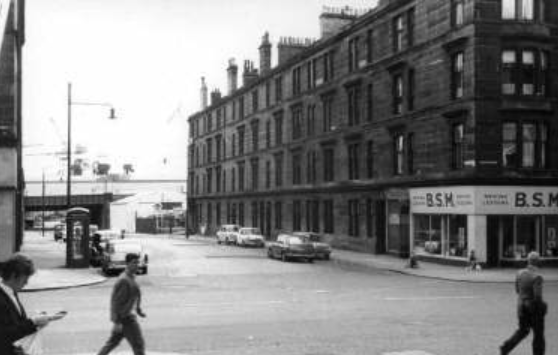 A young man walks over the cross at Dumbarton Road