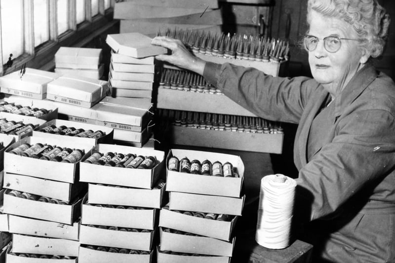 Inside the Standard Fireworks factory in April 1964. Pictured is Mary Avison packing hundreds of 'air bombs' all ready for the touch paper.