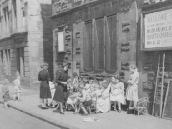 Children sit in rows for a meeting with the Partick branch of the Salvation Army