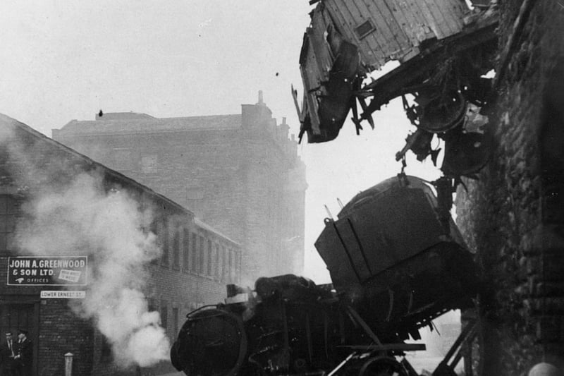 The aftermath of a rail crash in November 1964. A 150 ton locomotive and tender of a runaway goods train which plunged more than 30ft into Dryden Street.