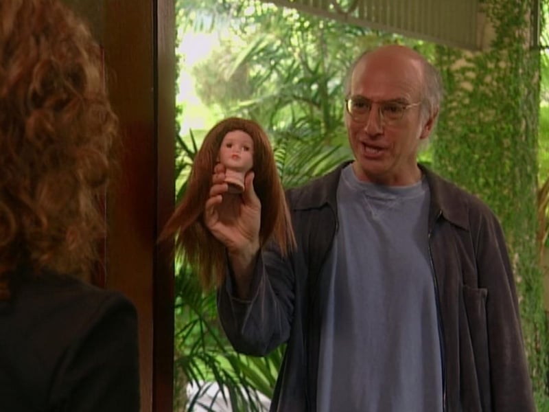 The Doll was the 17th episode of season two and was released in 2001. Larry causes trouble at a film screening - and isn't helped by an unlockable bathroom door.