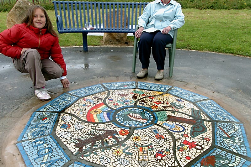 The unveiling of a mural at Victoria Park Gardens in May 2007. Pictued,is 87-year-old Mary Roberts of the Bramley Elderly Action Group with  Hollybush Primary School 
 pupil Natalie Sidhu.