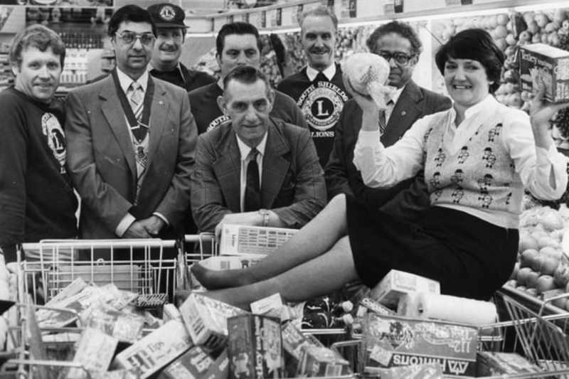 Margaret Raine did a three minute trolley dash round Hinton's store for her father George Elsy, centre, when his ticket came up in a draw held by the Lions Club. Remember this?