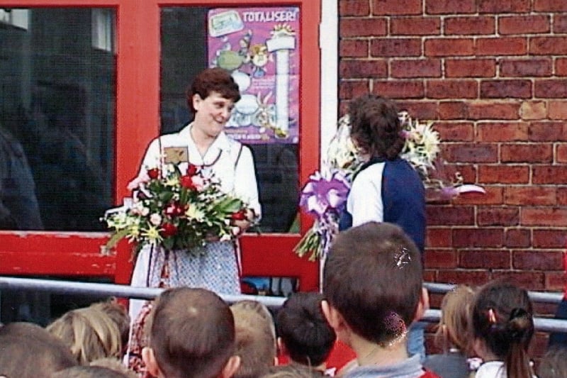 Dinner lady Christine Hartley says goodbye after retiring from Kippax Ash Tree Primary School. Pictured in April 2002.