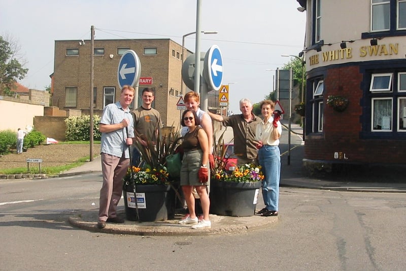 MP for Elmet Colin Burgon joined members of the Kippax Environment Forum and Coun James Lewis (Lab, Barwick and Kippax) weeding flower beds and clearing out rubbish  as part of Volunteers Week in June 2003.