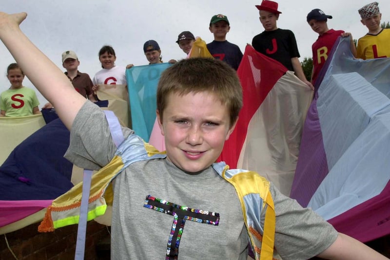 Dean Ellison who played the part of Joseph in Kippax North Primary School's production of Joseph and his Technicolour Dreamcoat. He is pictured with cast members in July 2003.