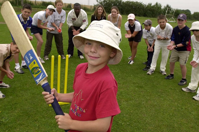 Thomas Whaite prepares to hit the ball during a cricket training session for children at Kippax Cricket Club in August 2003.