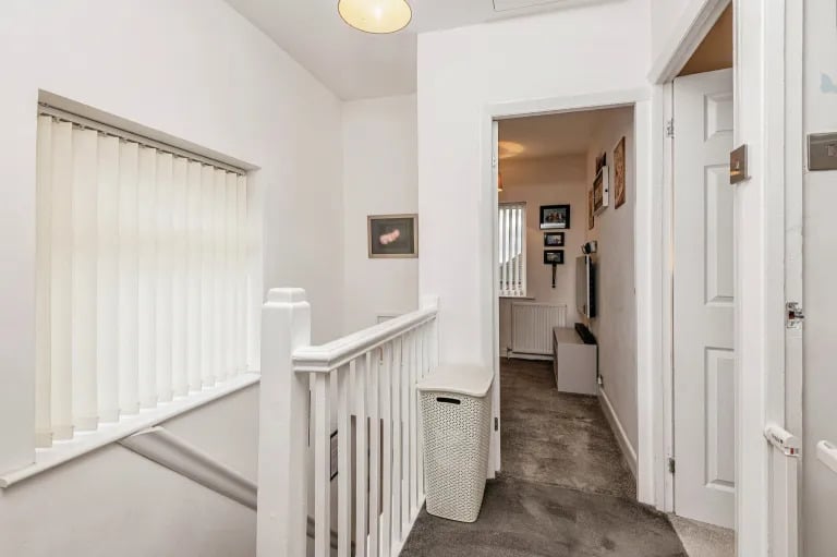 A bright landing gives access to the upstairs rooms.