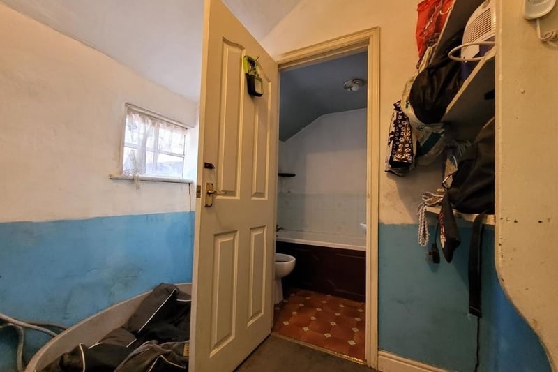 A toilet and storage area