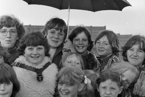 Sharing one umbrella are these members of the Sunderland Juvenile Jazz band in 1979.