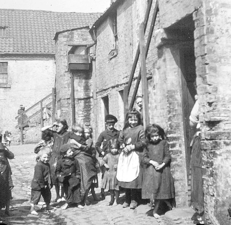 Taken from Glasgow's public health archives, this image shows children outside a Calton tenement.
