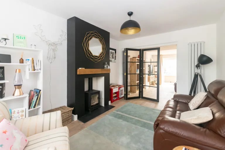 A relaxing sitting area with a log burner can also be found on the ground floor.
