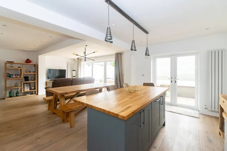 Here is a modern kitchen area with central island.
