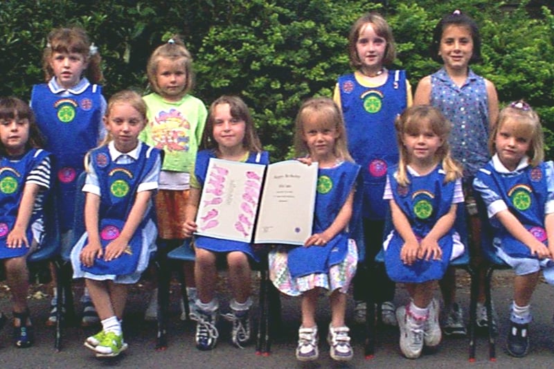 Children of Hawes Side rainbows with a birthday  card for the Queen Mother.
