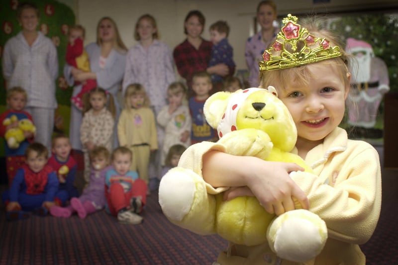 Kady Goodwin of Meadow Kindergarden gives Pudsey Bear a big hug for Children In Need