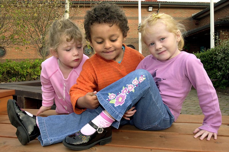 Jeans for Genes Day at Marton Primary School, South Shore. Sammy Stemp and Georgia Banister admiring the design on Grace Milner's jeans. (Reception class children)