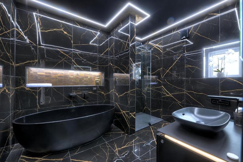 Very swish! The Higher Roller suite features a ultra-sleek black and gold ensuite bathroom