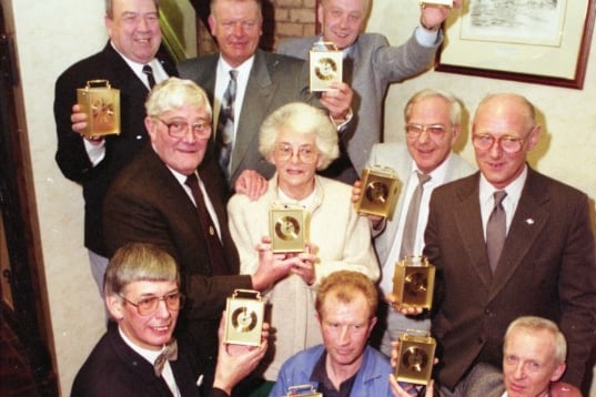 All these workers were presented with their long service awards in a ceremony in 1992.