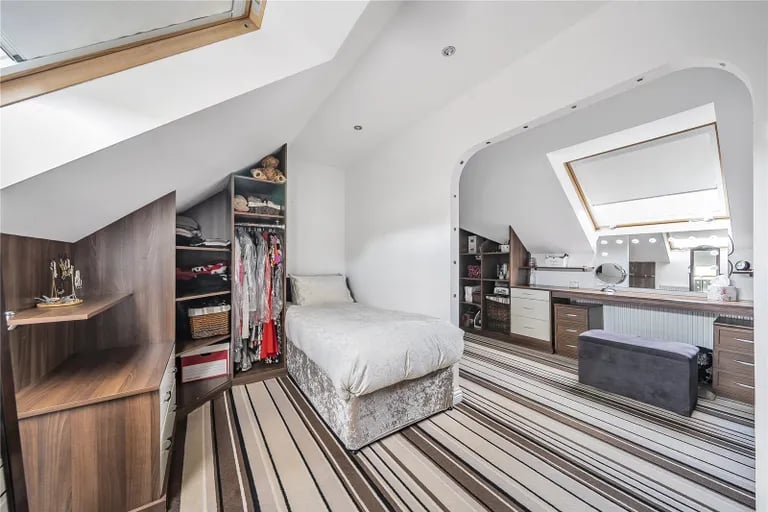 This bedroom/dressing room is a truly unique space with skylight windows.