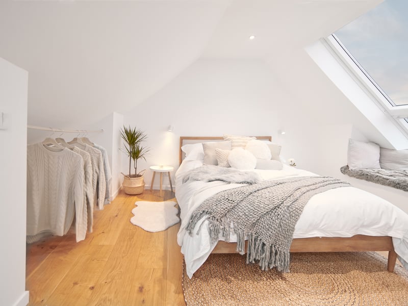 The kingsize bedroom has a window seat and Juliet balcony