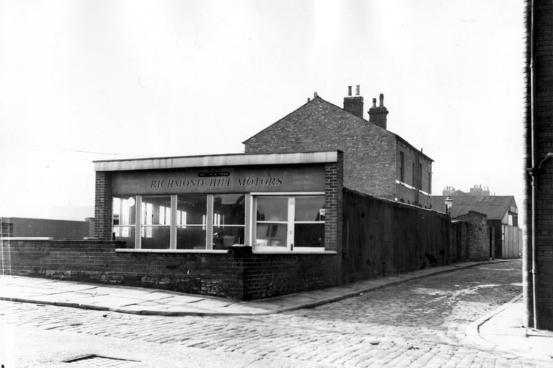 Looking from Lavender Walk at Richmond Hill Motors, a car sales showroom. Proprietors of this business were W. and W. Twigg. To the left is Butterfield Street, Danby Walk is on the right. Pictured in October 1963.