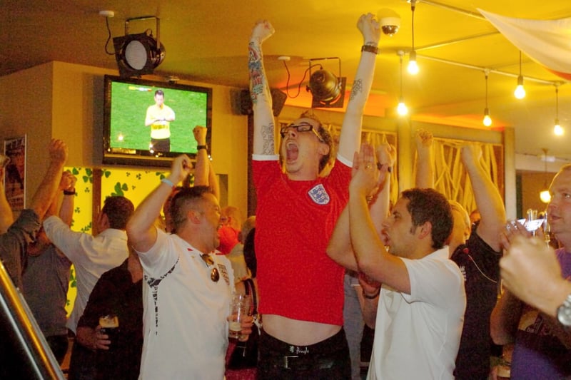 Fans celebrate England's World Cup win against Slovenia at the 2010 World Cup.
