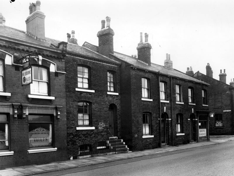 Albert Inn on South Accommodation Road pictured in October 1958. This pub was known locally as the Pocket Hole because it was so small, and was frequented by workers from the Donisthorpe Lax and Shaw Works. The landlord at this time was Ted Wood who provided the machine operators with as much beer as they could drink while they were working. These workers consumed on average about 8 pints per shift although some were known to drink up, to 20. The incredibly hot working conditions caused by the furnaces used to melt the glass meant that the workers sweated all of the alcohol out of their bodies.