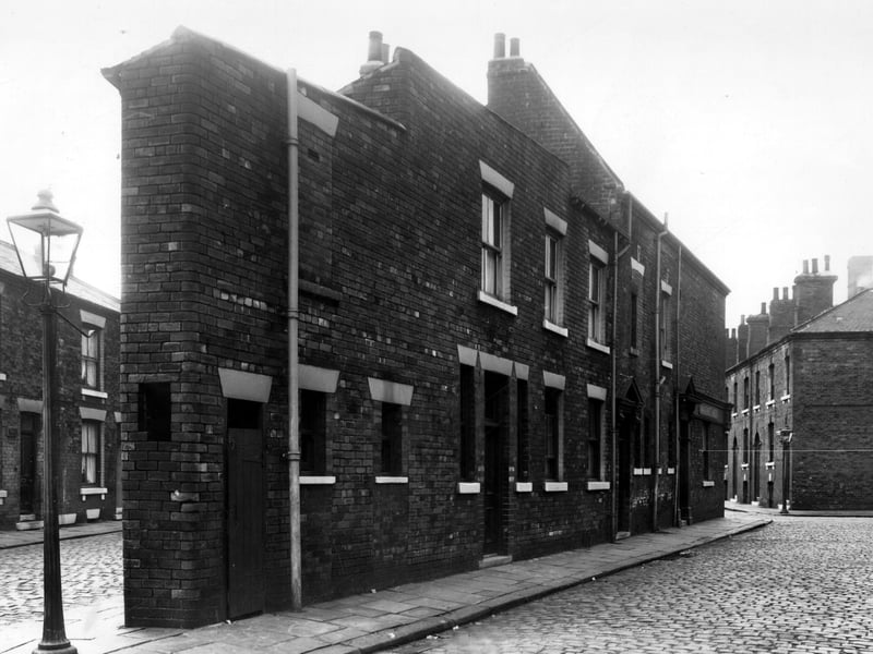 This view looks along Newby Street onto the back of The Clarence Hotel which had been converted from several separate dwellings into one wedge shaped building. Pictured in August 1958.