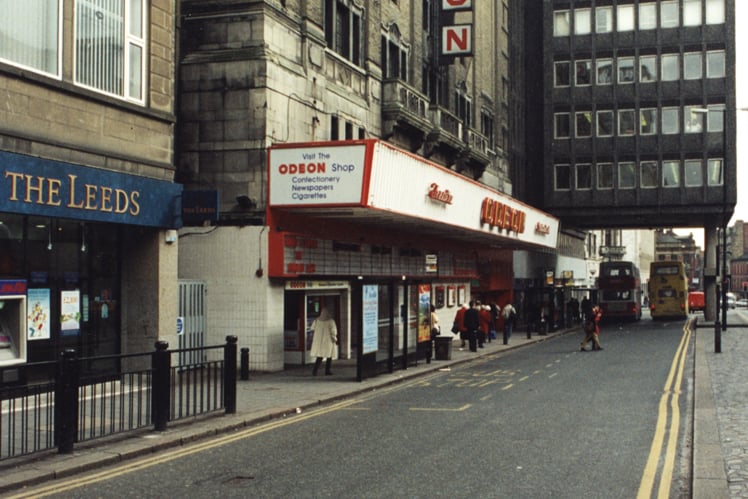  A 1995 photograph of the exterior of the Odeon cinema on Pilgrim Street Newcastle upon Tyne. The photograph has been taken from the top of Pilgrim Street looking down to the Odeon which is centre left. The Commercial Union building which straddles the road is beyond the Odeon. Part of the premises of The Leeds building society can be seen in the foreground to the left. 