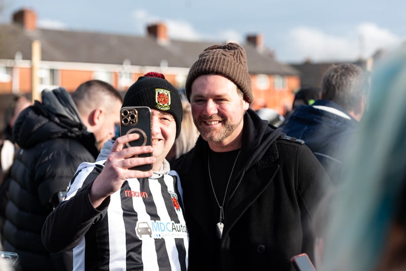 Former Westlife singer Brian McFadden posing for a selfie with a Chorley FC fan