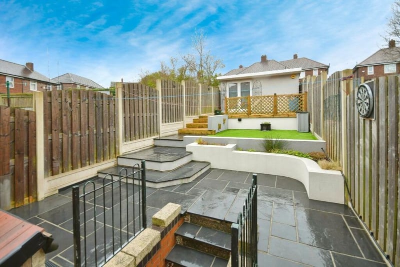 The "lovingly" landscaped garden is large and makes clever use of the hilly foundations.