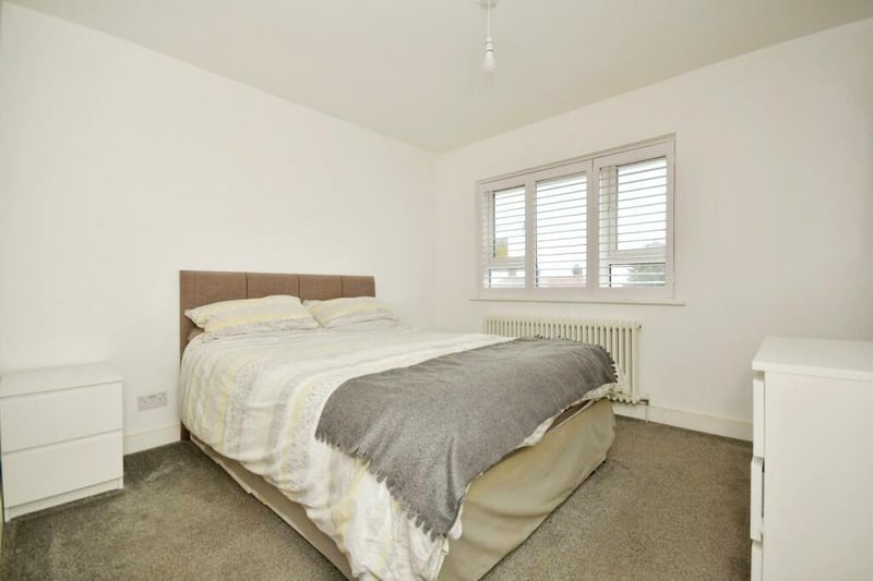 The main bedroom is simply designed, with ample storage.
