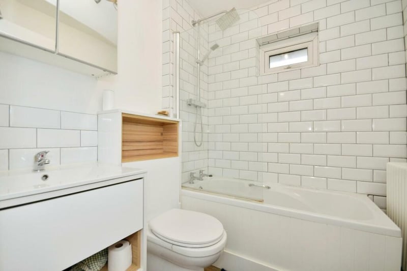The family bathroom includes a bath, rainfall and handheld shower.