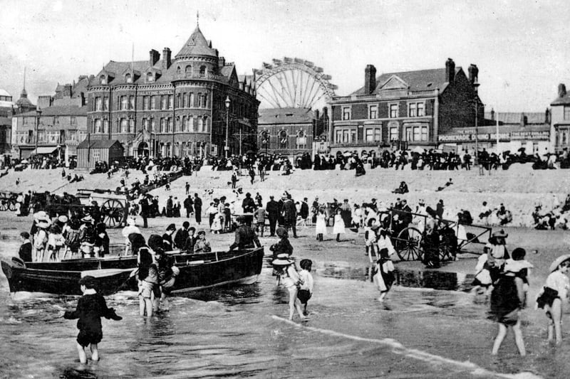 Boat trips were kept busy as youngsters paddled in the waves in this 1905 view