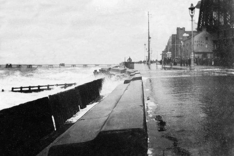 Storm scene on Central Beach in 1893. The central section of the Tower Buildings are being put up around the base of the Tower itself. The Promenade was widened by 100ft when a new sea wall was completed in 1905