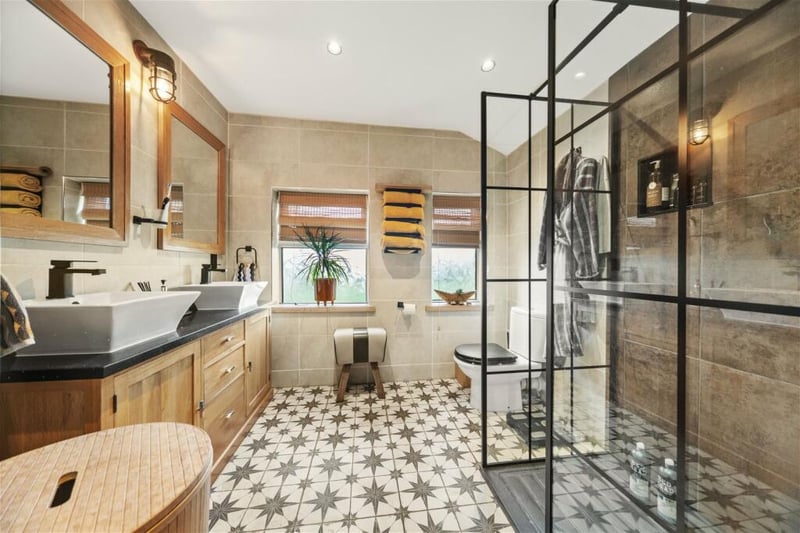 The family shower room on has electric underfloor heating and a four-piece suite with large walk-in shower.