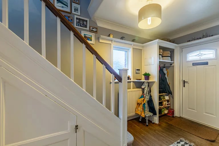 The Alwoodley home greets you with a spacious and welcoming hallway with original parquet flooring.