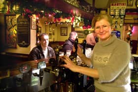 Ann Flynn behind the bar at the Dog & Partridge pub, on Trippet Lane, Sheffield city centre, in 2000