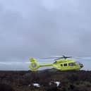 The Yorkshire Air Ambulance at the scene of a Peak District rescue on Saturday after a plunge from rocks. Picture: Edale Mountain Rescue