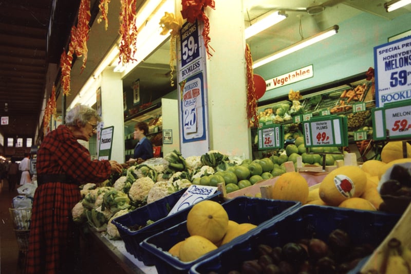 A view of the Grainger Market Newcastle upon Tyne taken in 1988. The photograph shows the premises of a fruit and vegetable seller.