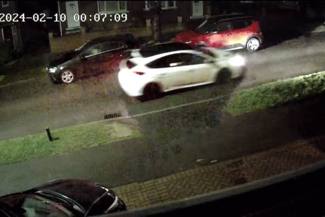 The car, now with its steering lock removed, being driven down Flockton Road at 12.07am. It took approximately eight minutes total for the thieves to access it, roll it away, cut off the steering lock and be gone.