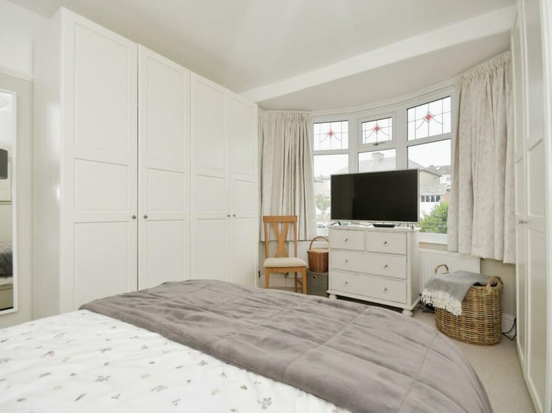 This double bedroom has bay windows facing out to the front of the property.
