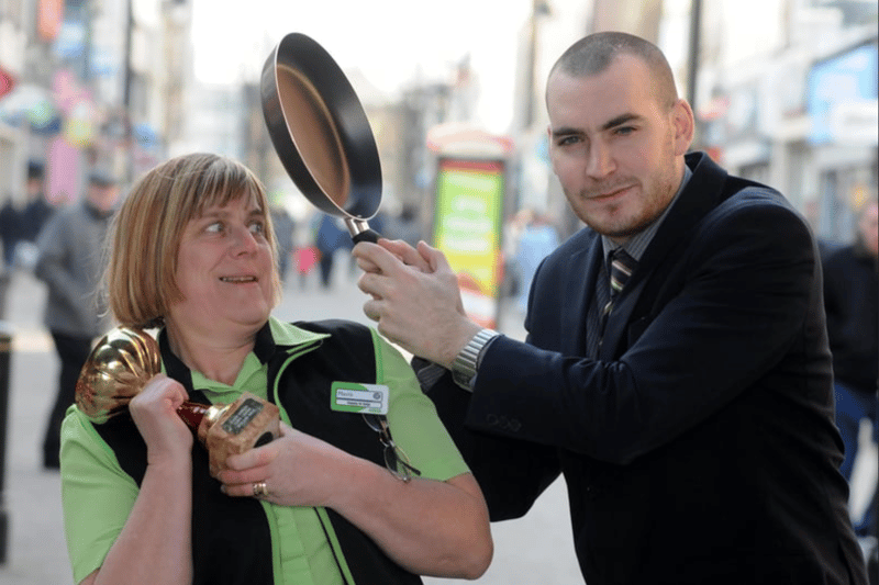 Asda's Mavis Maughan and Specsavers Scott Pinckney prepare for the annual pancake race in 2012. 
