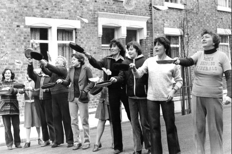 Practising pancake flips before the annual race organised by Hyde Street Venture Group in 1980. Who do you recognise in this photo? 