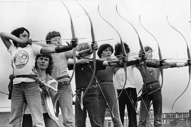 Young archers of Ashley Road Junior School, take aim in 1981 with help from Mrs James. Left to right are: Ken Geen, 10; Wayne Thompson, 10; James Lynch, 10; Gillian Mennie, 11; Lee Reed, 11; Sharon Lynn, 11