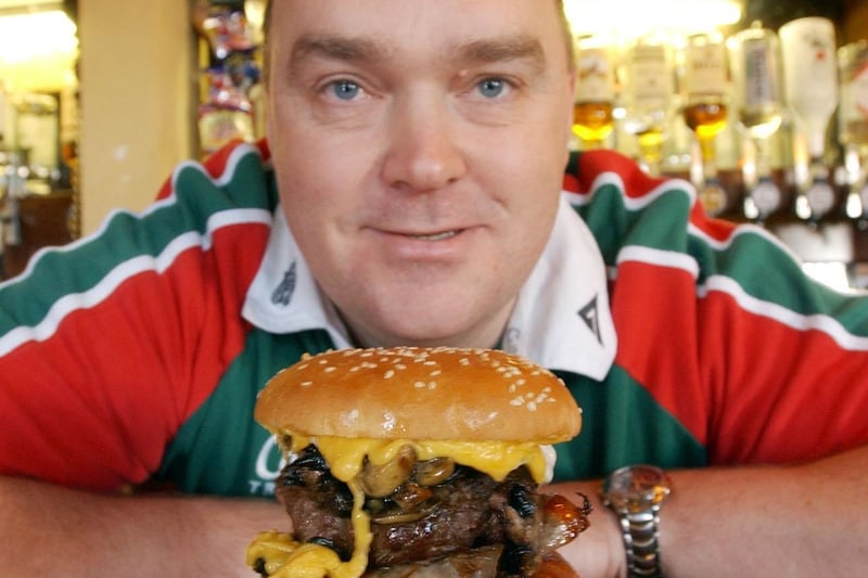 Pub manager Paul Stevenson with the El Torro burger which was on sale 20 years ago.