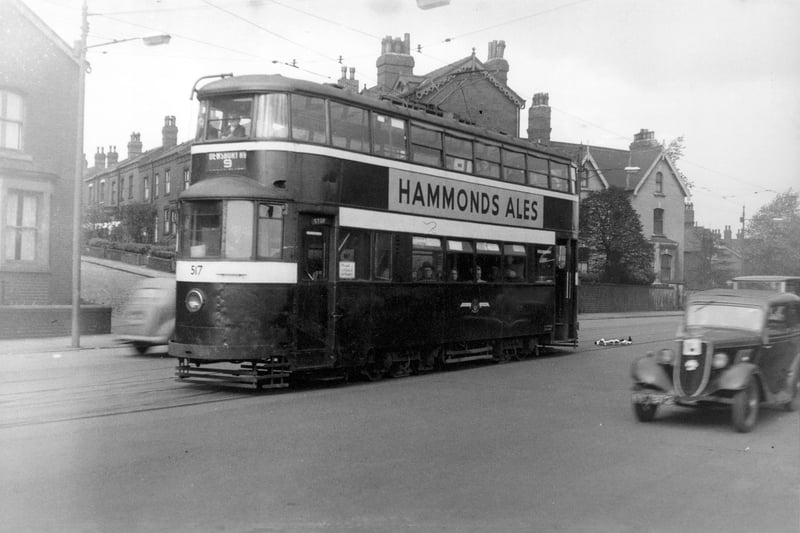 A view of tram trundling down Dewsbury Road in September 1954. 