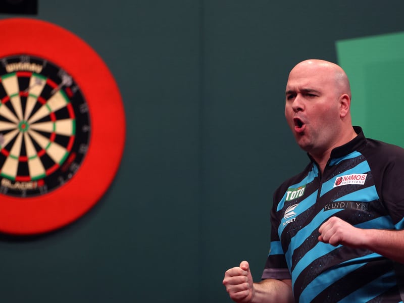 The darts player attended a Rangers game last season and was spotted at Edmiston House ahead of the game against Ross County. Cr. Getty.