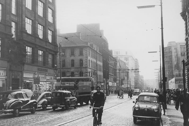 A view along a busy Argyle Street from the Trongate in the early sixties. An advert for the new Marks & Spencers store on the corner of Argyle Street and Glassford Street can be seen on the right of the image. 